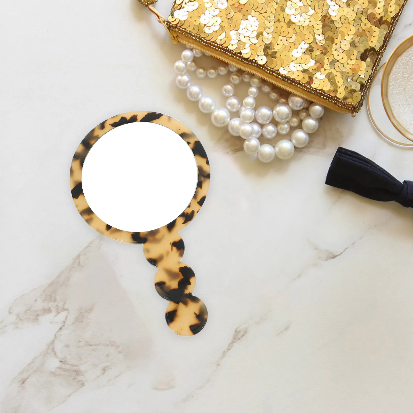 Miroir de poche léger pour le maquillage, design compact rond portable, résistant aux chocs, texture lisse, idéal pour les voyages et l'usage quotidien