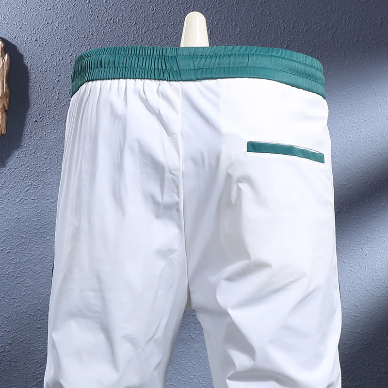 

Summer new thin white breathable elastic slim fit ankle binding casual pants for men, fashionable light luxury sports pants