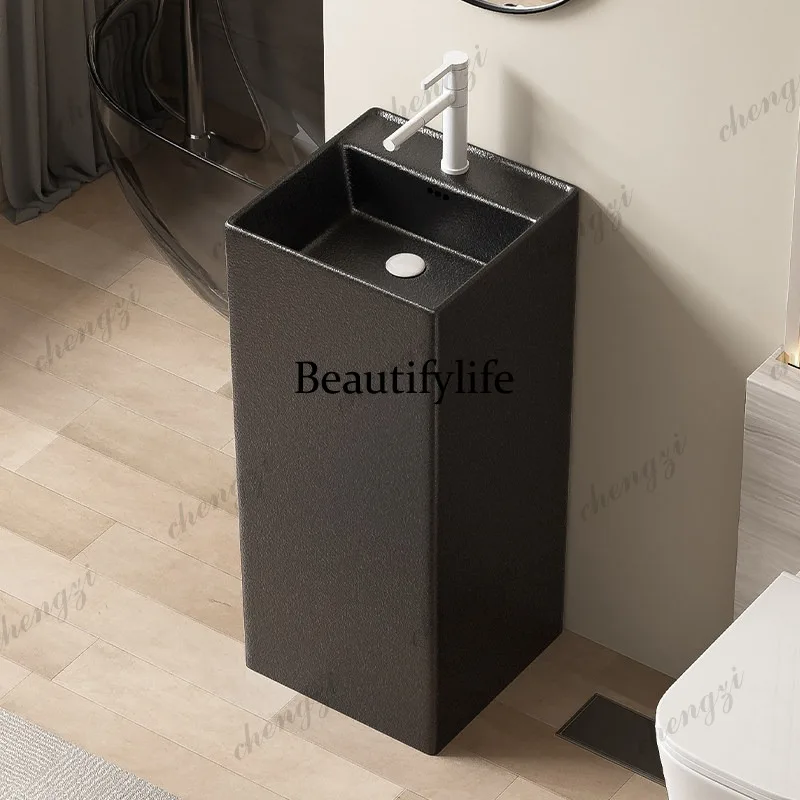 Matte black ceramic column basin integrated floor bathroom small apartment courtyard outdoor vertical wash basin