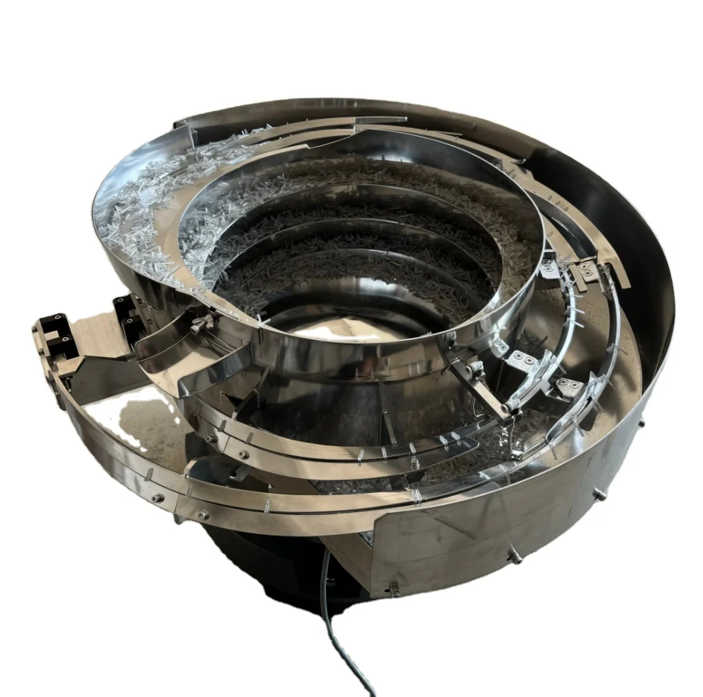 

Multi-Outlet Vibratory Bowl Feeder for Distributing Parts to Multiple Assembly Stations