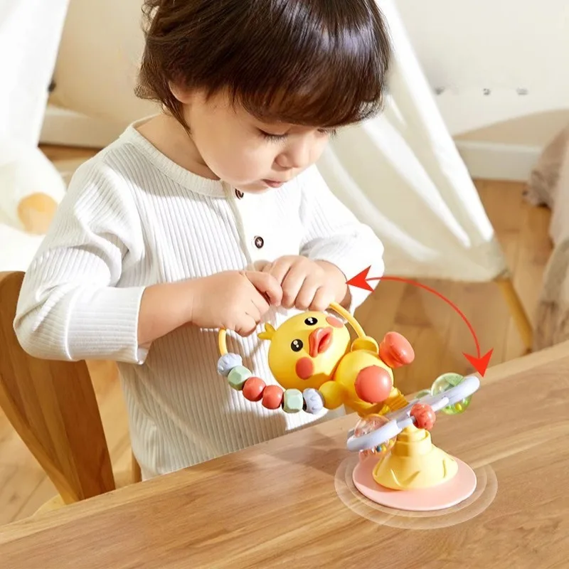 كرسي الطعام، أكواب شفط، ألعاب موسيقى دوارة، قبضة ألغاز التعليم المبكر، خشخيشات للأطفال البطة المهدئة بعمر 0 سنة واحدة