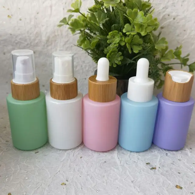 

100pcs Bamboo Lids Pink Green Purple Blue 30Ml Luxury essential oil serum glass dropper bottles with pipette cosmetic packaging