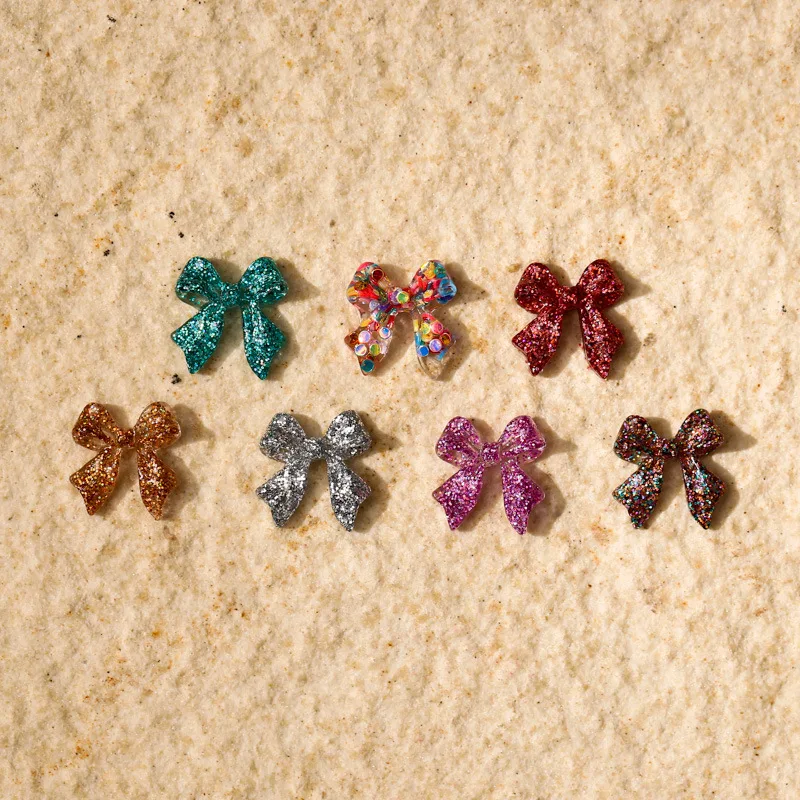 50 stücke Glitter Gemischte Farbe Bogen Nagel Charms 3D Kawaii Glänzende Pailletten Bögen Nagel Dekoration DIY Design Nagel Zubehör 11*12mm