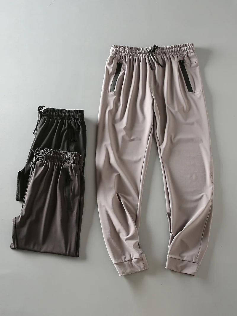 

Мужские спортивные брюки из ледяного шелка: эластичные, быстросохнущие, дышащие, свободного кроя, для активного отдыха, модные, летние, новинка