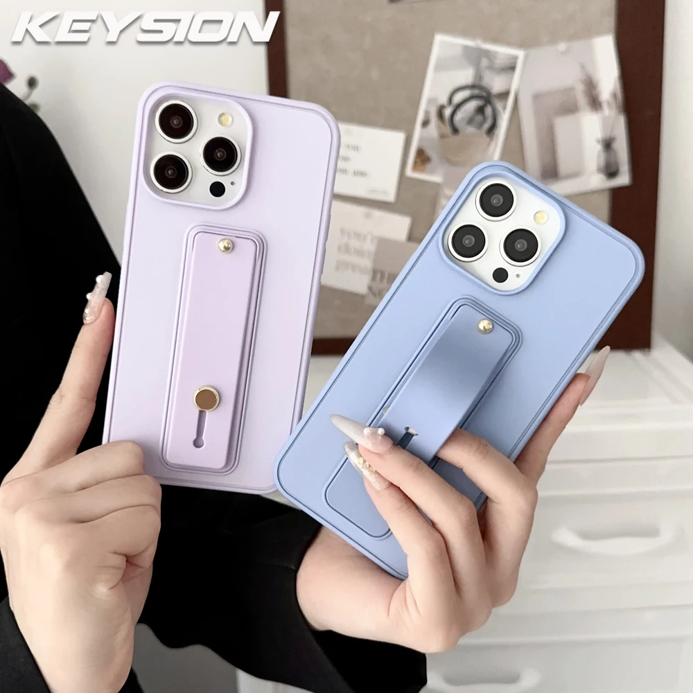 

KEYSION Wrist Strap Phone Case for iPhone 13 14 15 16 17 Pro Max 17 Air 16 Plus Wristband Kickstand Matte Shockproof Back Cover