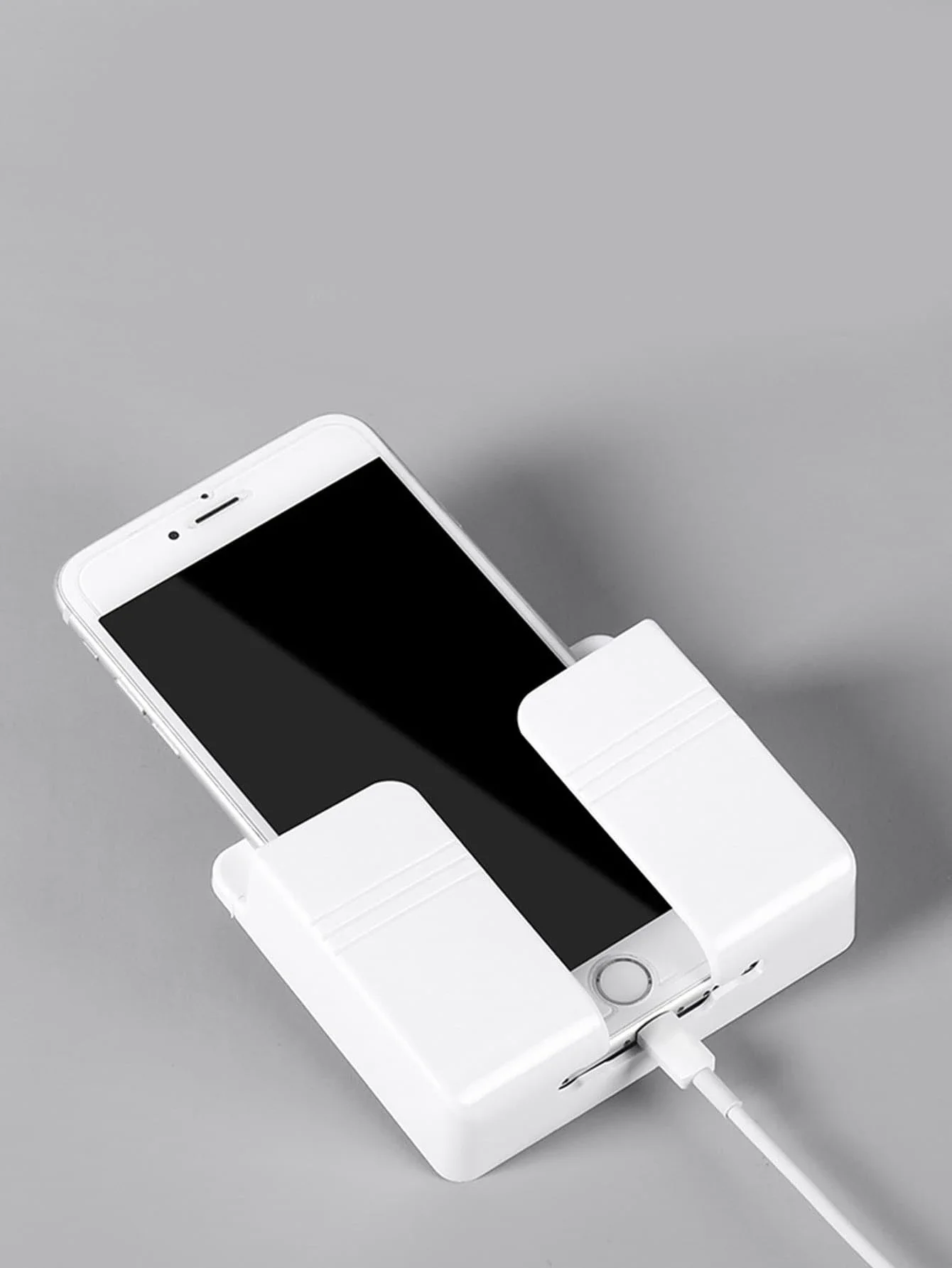 1 soporte para teléfono montado en la pared.