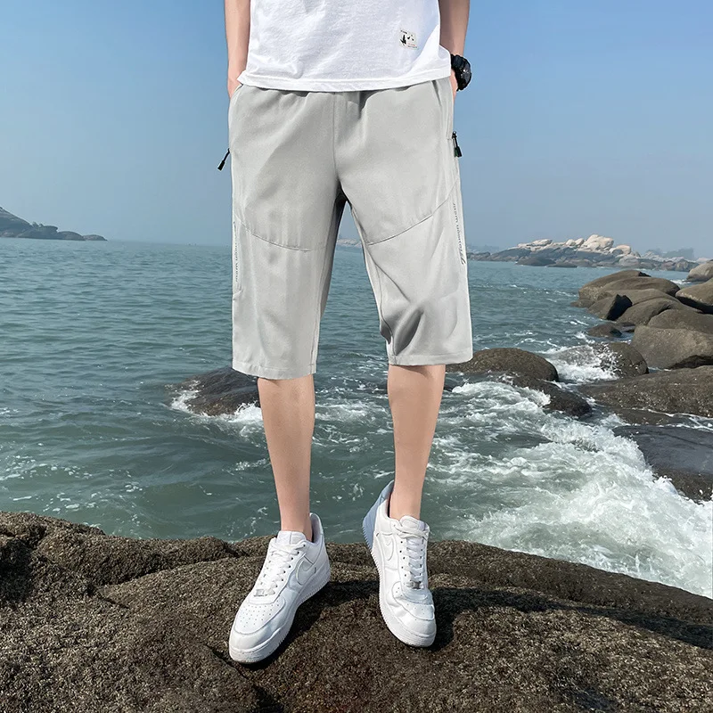 Pantalones cortos sueltos informales para hombre, Shorts deportivos finos transpirables a la moda, simplicidad de verano, cinco Pantalones rectos