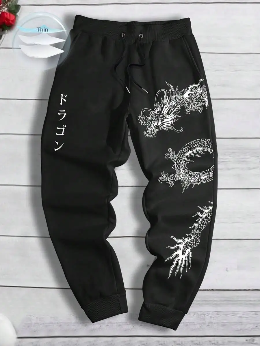 

Black Loose Fit Sweatpants with White Dragon Graphic and Japanese Script