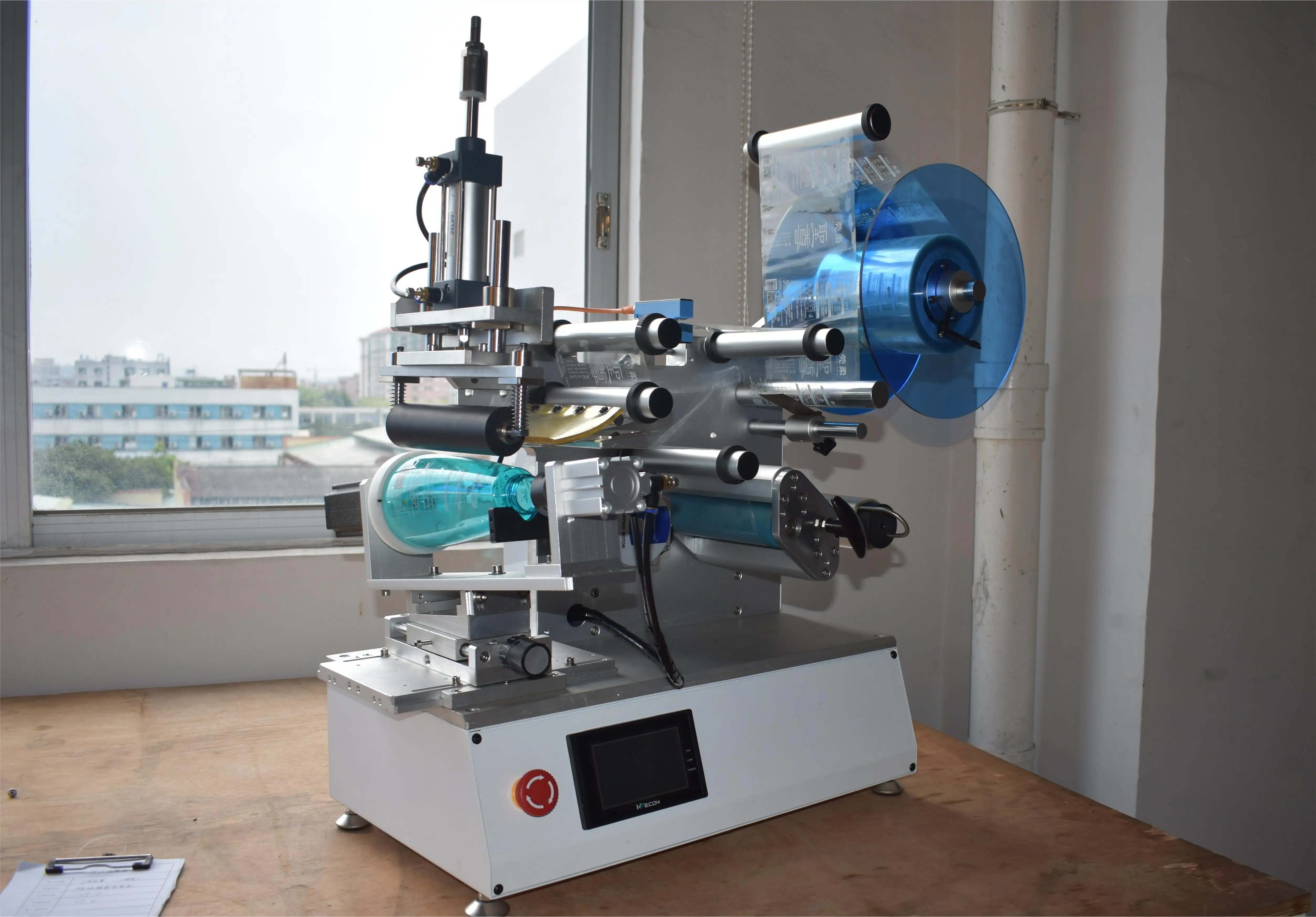 

Semi-automatic Desktop Sticker Machine Label Round Bottle Turn Around Labeling Machine