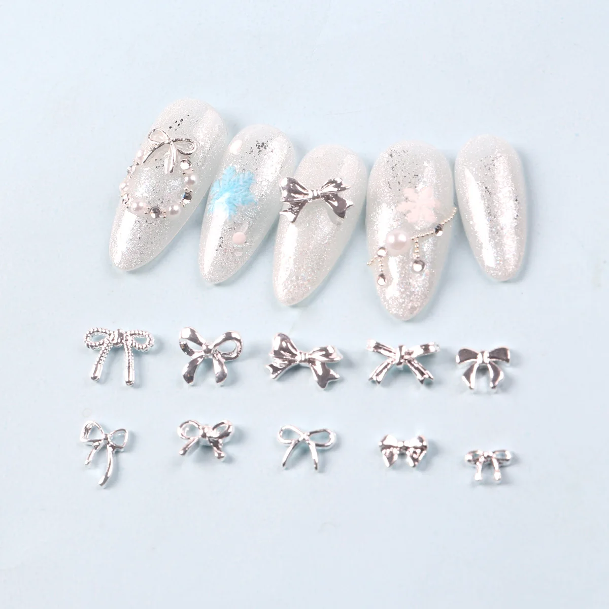 TSZS الفضة ثلاثية الأبعاد القوس مسمار الفن سحر سبيكة معدنية لطيف مزيج صغير شكل القوس الشريط الأظافر الديكور DIY بها بنفسك مسمار الملحقات