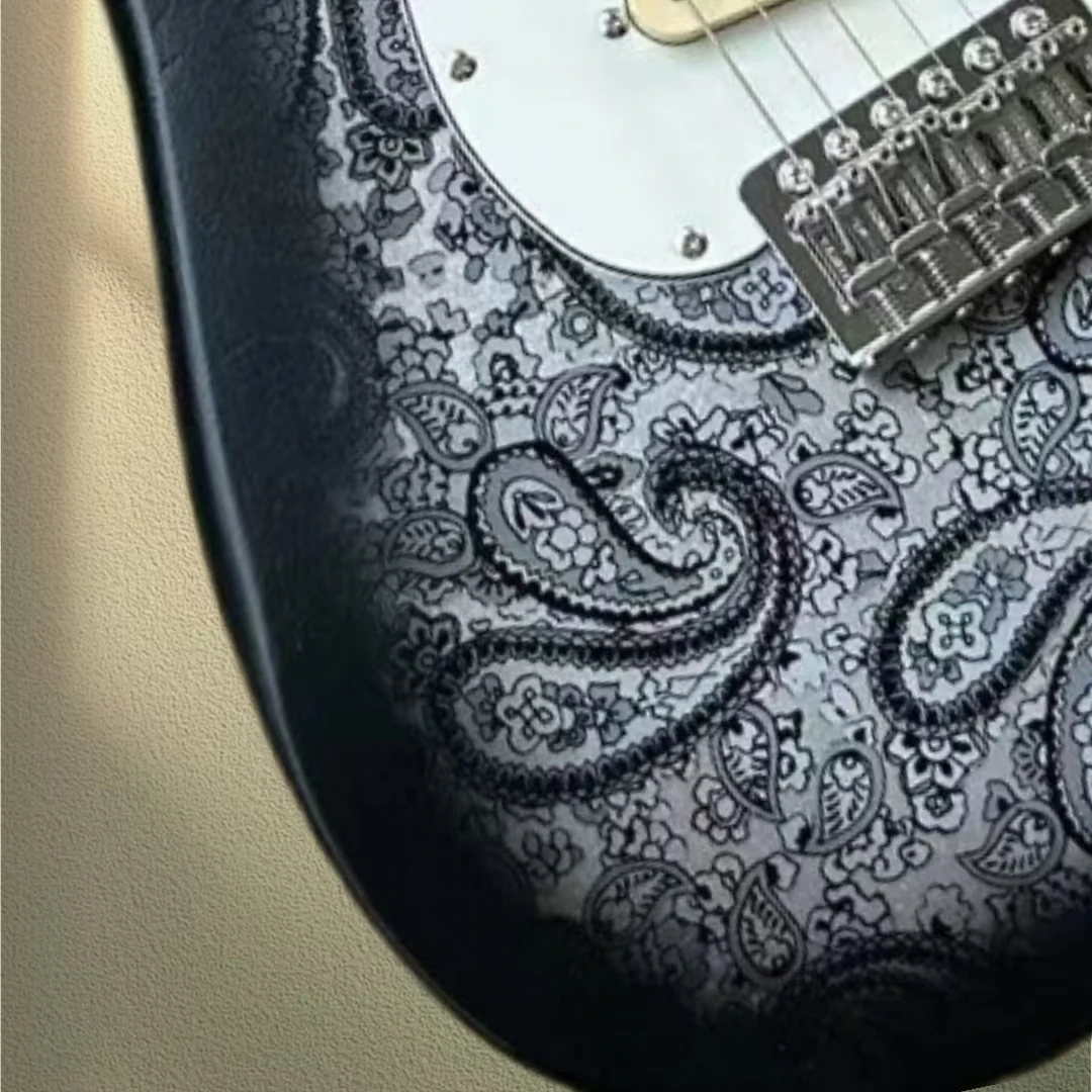 Heirloom coral electric guitar, Paisley gray decal