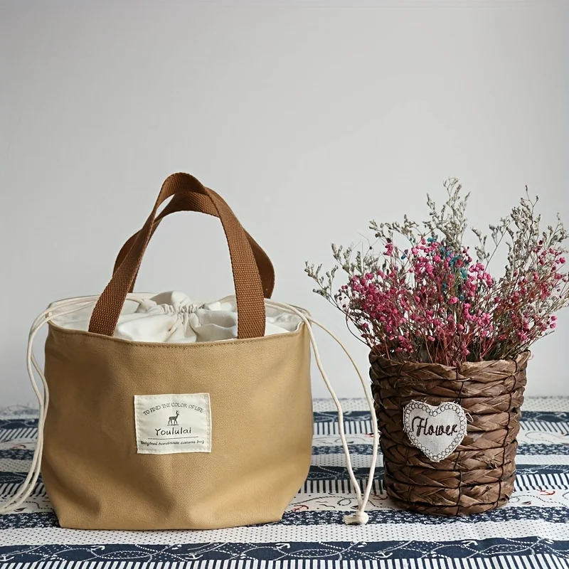 Simple solid color Japanese-style and breezy lunch bag, convenient portable canvas bag with thick lunch box bag lunch bag.