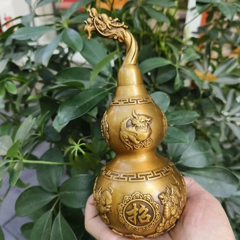 

Brass open lid gourd with hollow opening for attracting wealth and fortune. Exquisite craftsmanship of copper gourd for home cra