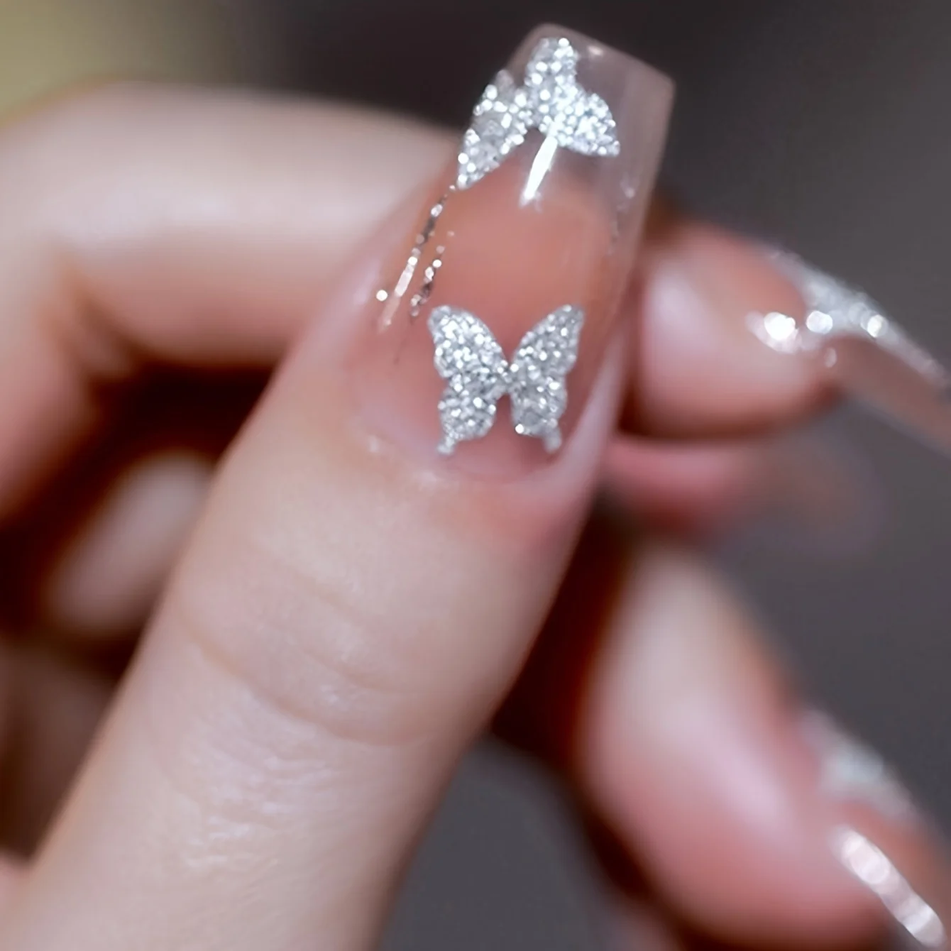 2 pezzi di glitter argentati farfalla / stelle design adesivi per nail art forcina autoadesiva decorazione della cassa del telefono cellulare accessorio fai da te