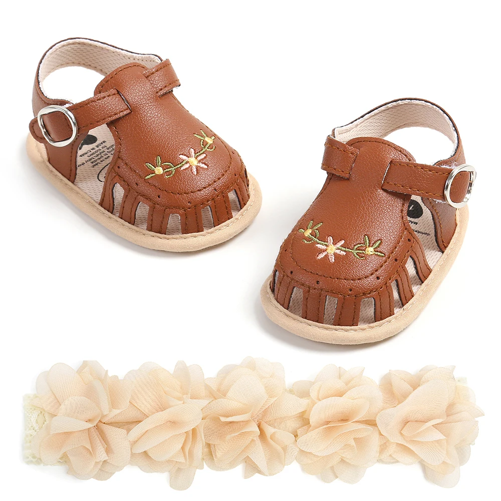 

Baby girl baby shoes with hollowed out embroidery and floral headband decoration soft sole and anti slip first walking shoes