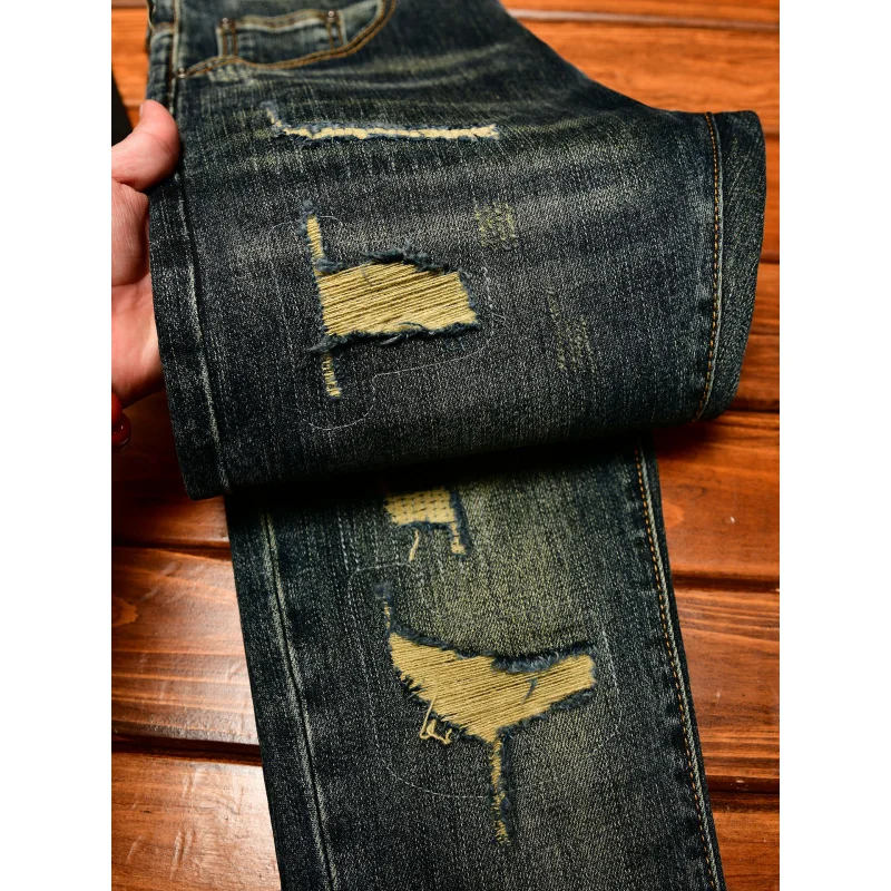

High end trendy ripped jeans for men in autumn 2025, nostalgic men's clothing, retro elastic fashion, slim fit, small leg pants