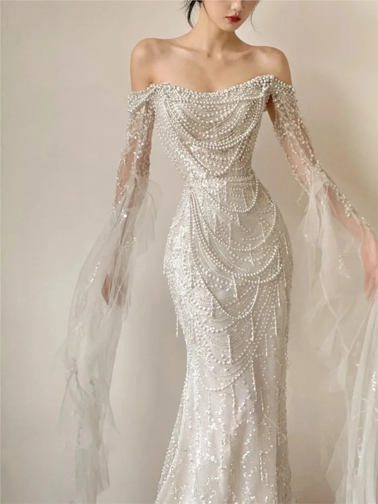 A one-shoulder light luxury style heavy fishtail and niche welcome dress for going out