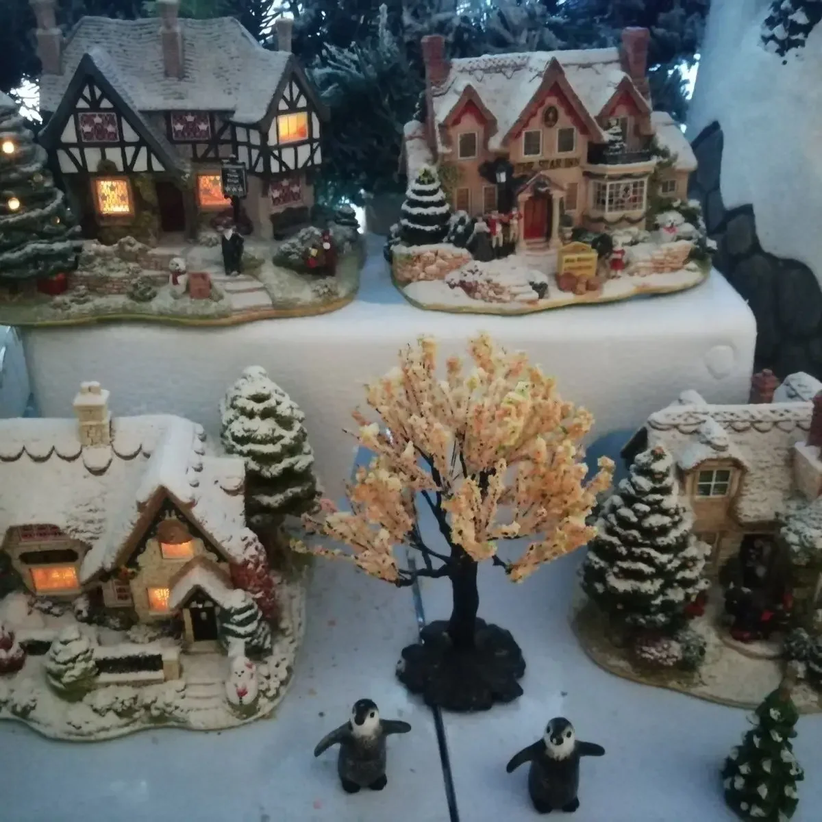 Four combinations of Christmas snow house ornaments
