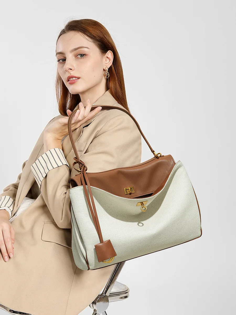 

High-End Rodeobag Canvas Cowhide Women's Tote Bag Large Capacity Niche Armpit Design for Commuting Stylish And Practical