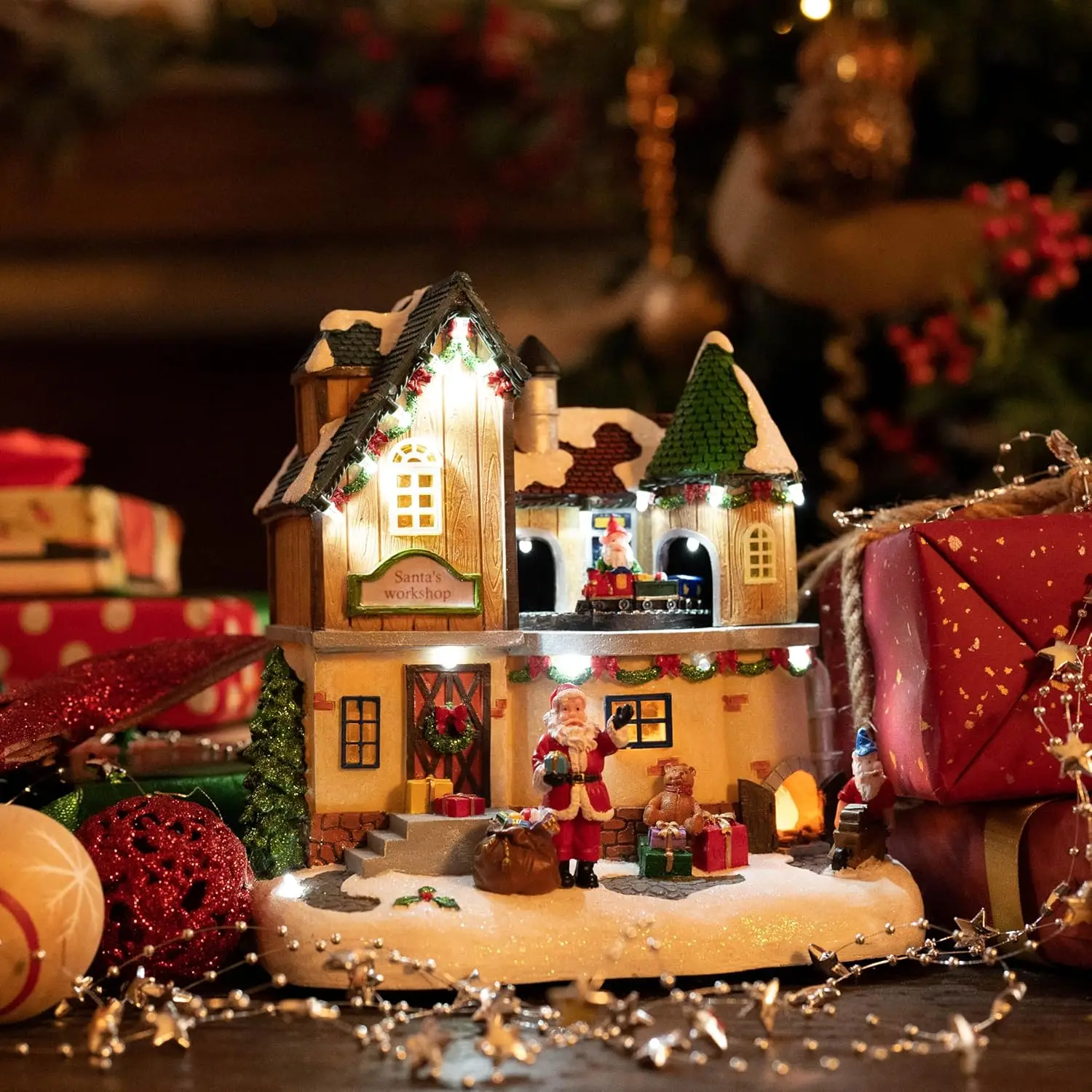 Taller de Papá Noel iluminado con pueblo navideño, estatuilla giratoria con música y luces LED, decoración navideña de 10 pulgadas