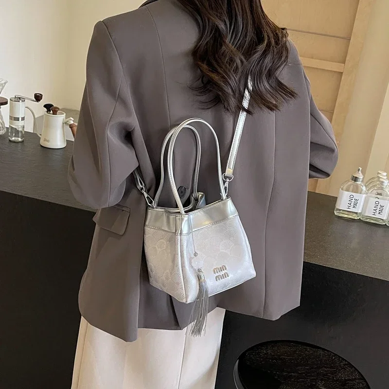 

Trendy Minimalist Unique Crossbody Bag with Letter Logo for Women Casual Leisure and Commuter Activities