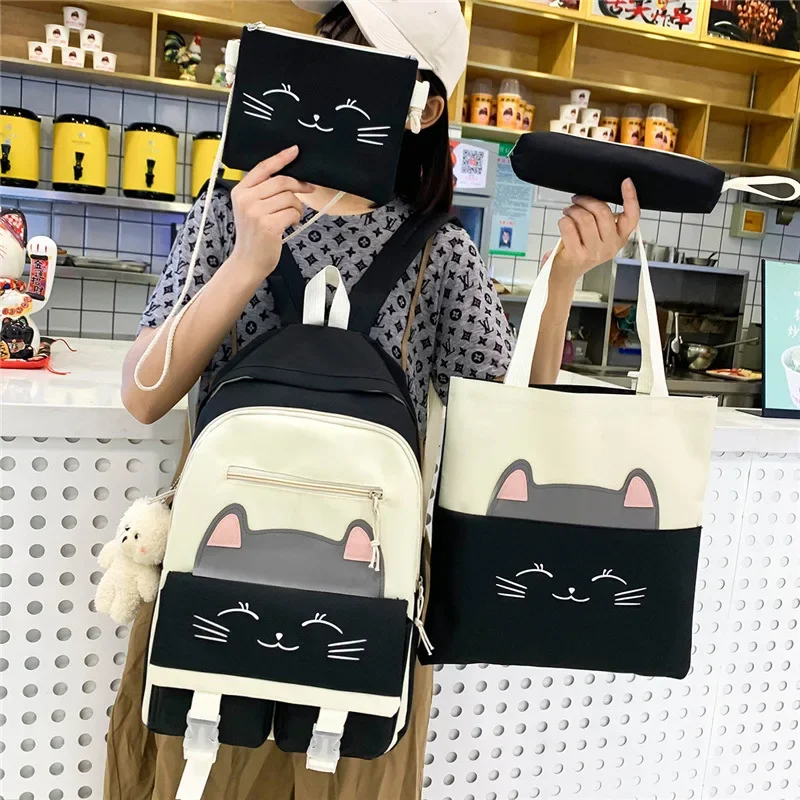 schoolbag women\'s new cartoon cute cat schoolbag for elementary school students for grades three to six four-piece backpack