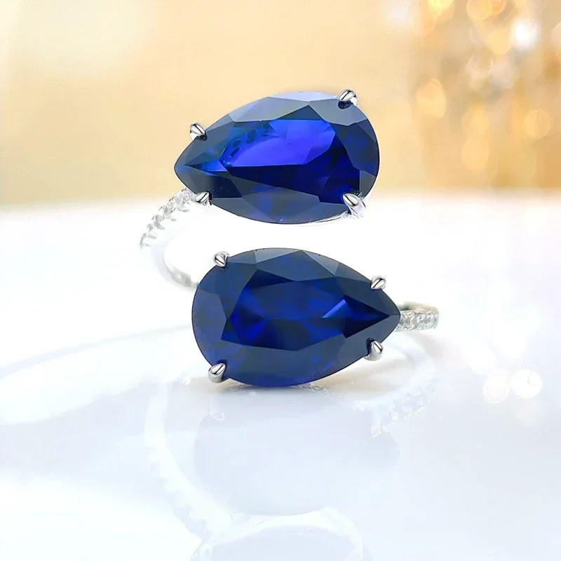 

Fashionable and minimalist drop opening sapphire blue 925 sterling silver ring paired with high carbon diamond wedding jewelry