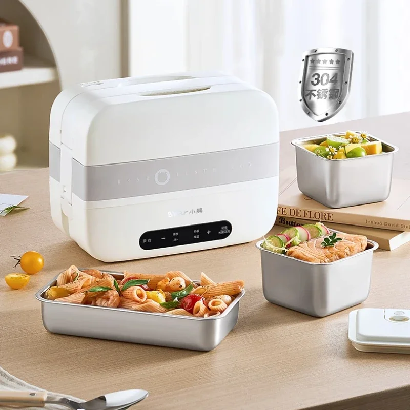 Heating lunch box can be plugged in for steaming and heat preservation. Self-heating lunch box. Office worker hot meal artifact