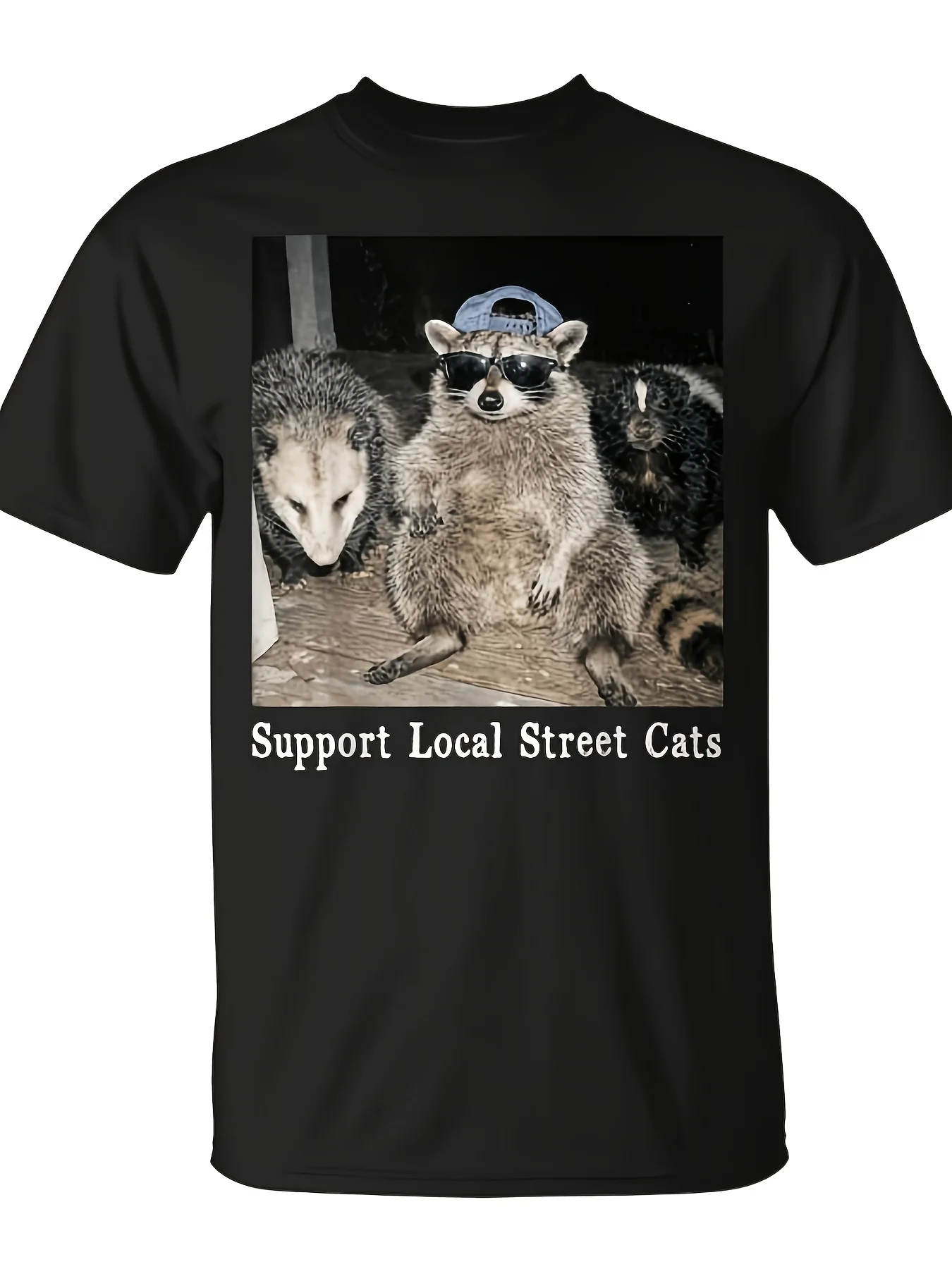 Supports local street cats, raccoons, skunks, and civets meme T-shirt. Unisex, fun Christmas novelty item, men's style, summer trendy streetwear, top-quality, comfortable and casual, retro round neck, geometric pattern, suitable for daily commuting and outdoor activities