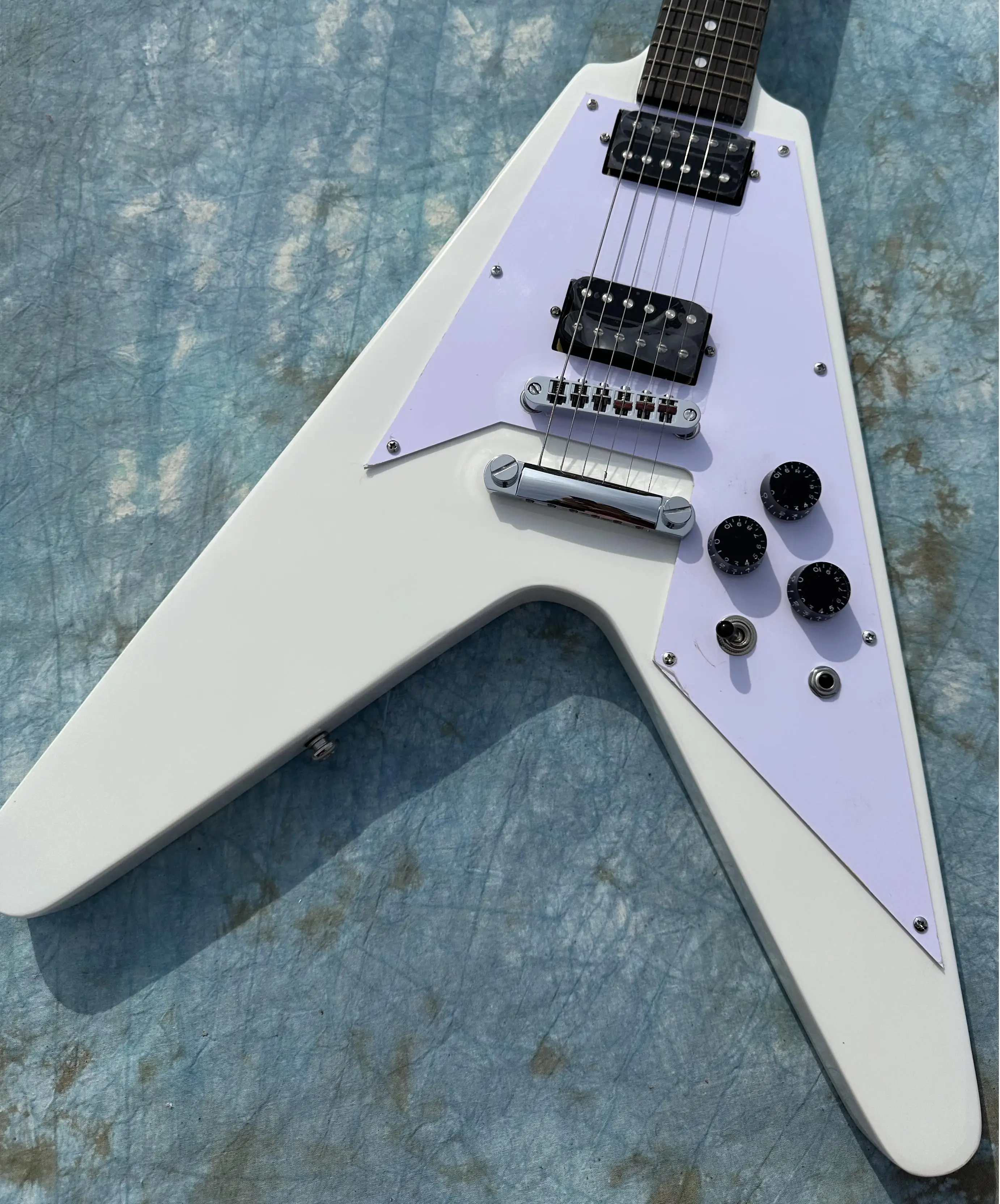 Irregular electric guitar, white flying V, black open pickup, imported wood and paint, shiny, in stock, fast shipping