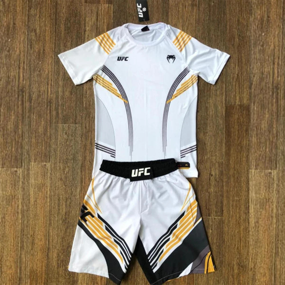 Nuevo conjunto de campeón nocturno de lucha UFC 324 blanco/dorado, jaula octogonal MMA, conjunto de Jujutsu de boxeo transpirable de gran tamaño para hombres y mujeres