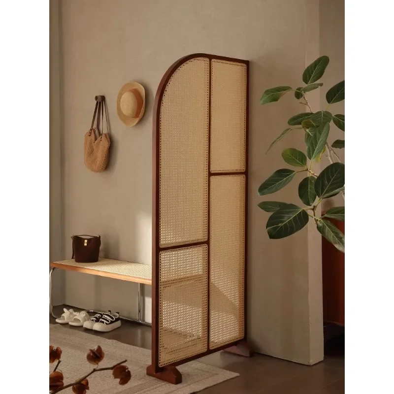 solid wood rattan screen partition is opposite the door to the home, living room entrance is blocked, and mobile