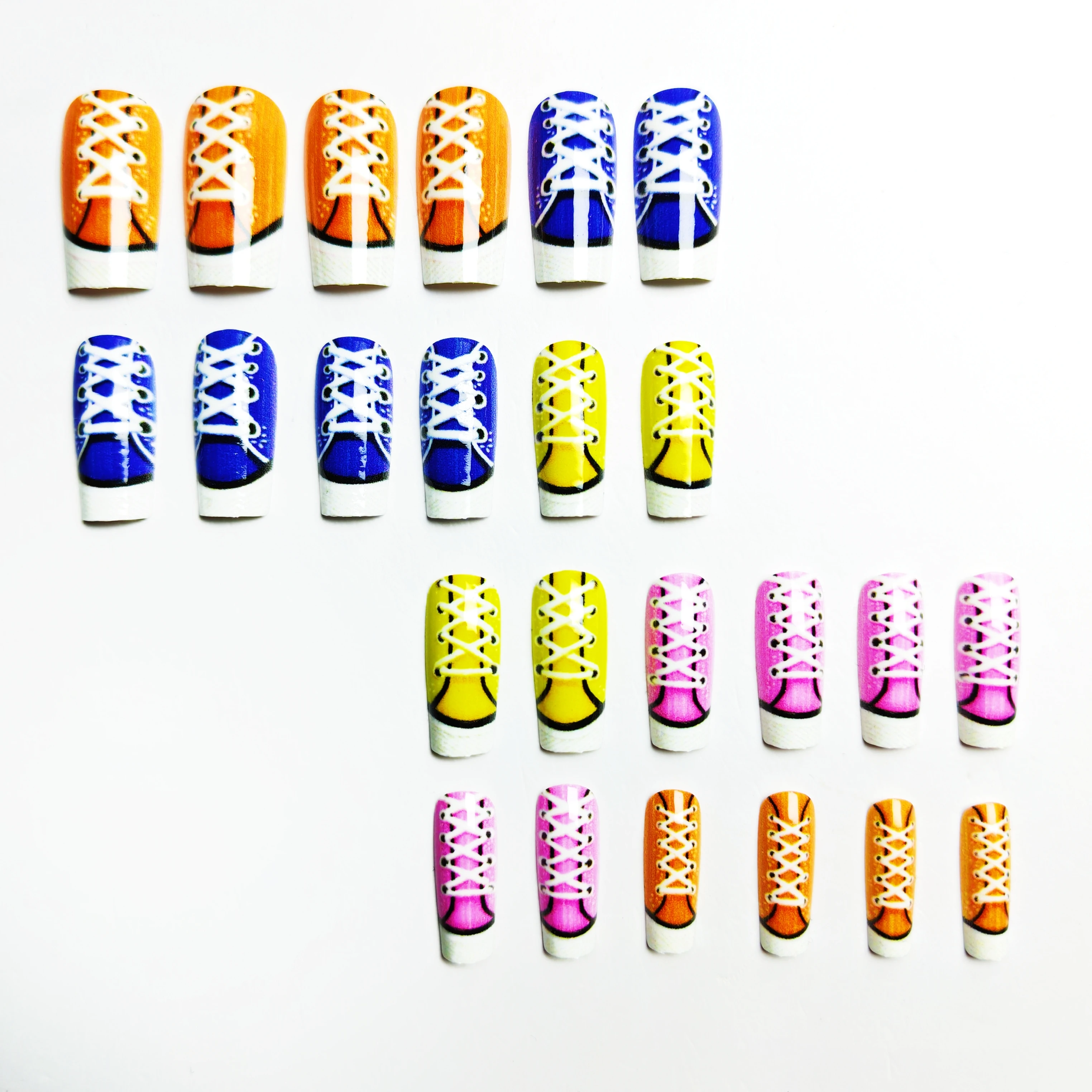 24-Piece Press-On Nails in White, Black, Yellow, and Blue Designs, Featuring Sneaker-Style Designs, Mid-Length Tube-Shaped Nail Tips, Glossy Removable Fake Nails, Suitable for Daily Use and Fashion Matching
