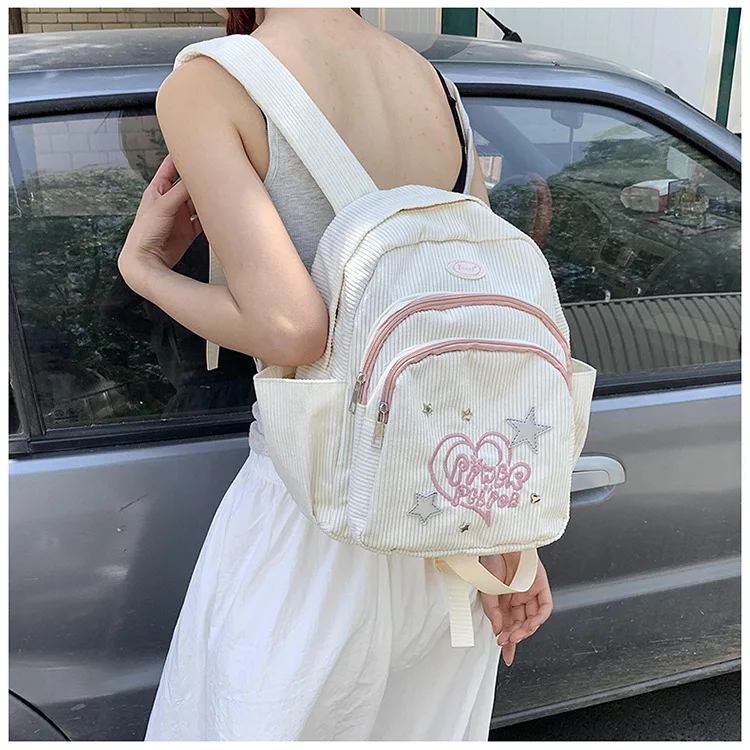 This simple embossed corduroy backpack for girls is cute, unique and versatile for commuting