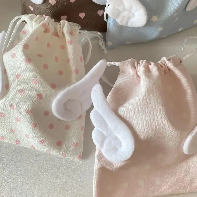 

INS Canvas Angel Wings Star Storage Bag Fashion Portable Bundle Pocket Drawstring Design Cosmetics Bag Travel Tote Bag Pouch