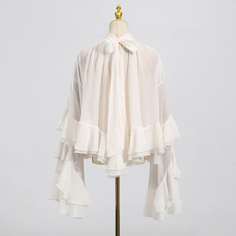 New style of the fashion season - elegant and stylish netted sleeveless top with wooden earflaps and long sleeves