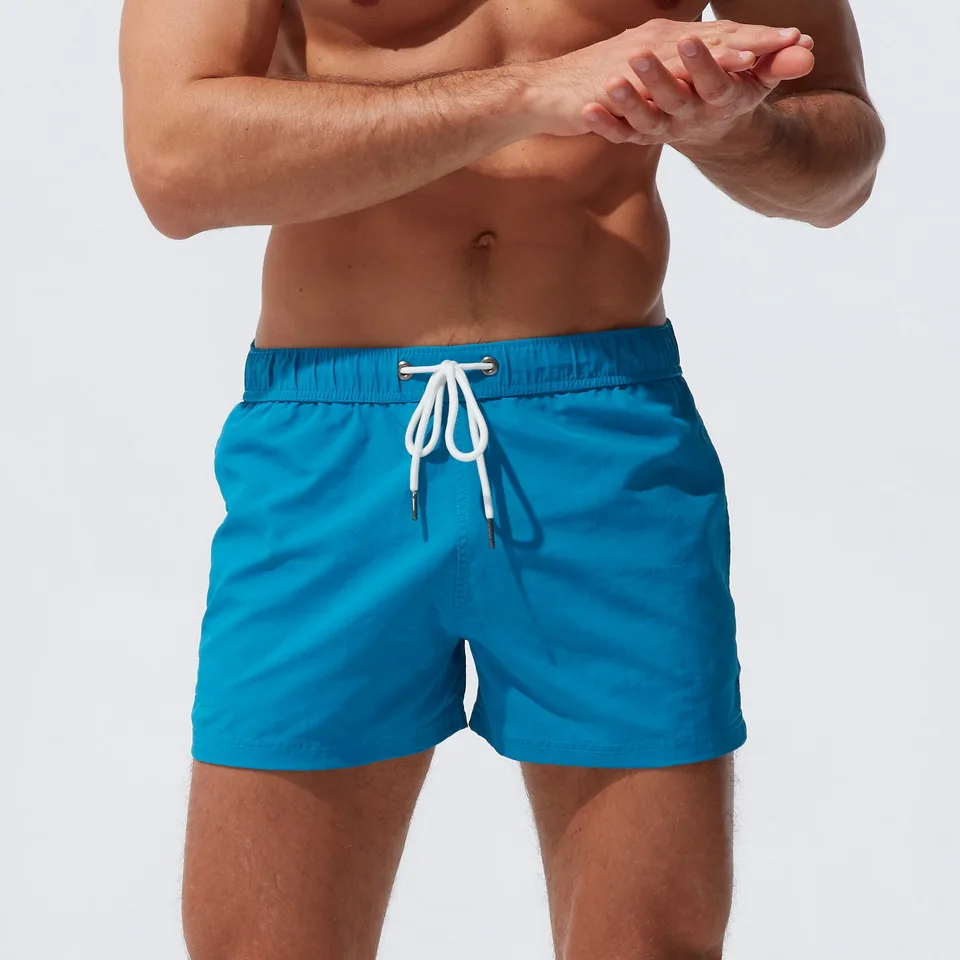 Summer Men's Beach Shorts Thin Section Solid Color Micro-Elastic Nylon Swimming Sports Fashion Zipper Shorts