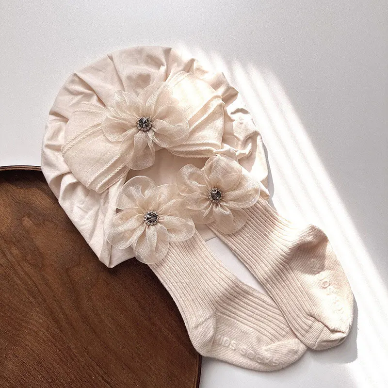Prinzessinnen-Baby-Turban-Mützen-Socken-Set Süße Schleife Blumenmädchen Indische Mützen Weiche Baumwollsocken Neugeborenen-Fotografie-Requisiten Kopftuch-Mützen