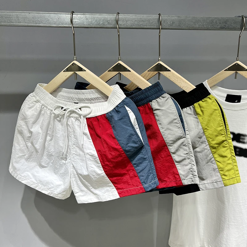 

Qui Dry Summer Splice Мужчины Женщины Внутренняя футболка Quarter orts Повседневные спортивные штаны для бега Fitn Faion Пляжные брюки для плавания...