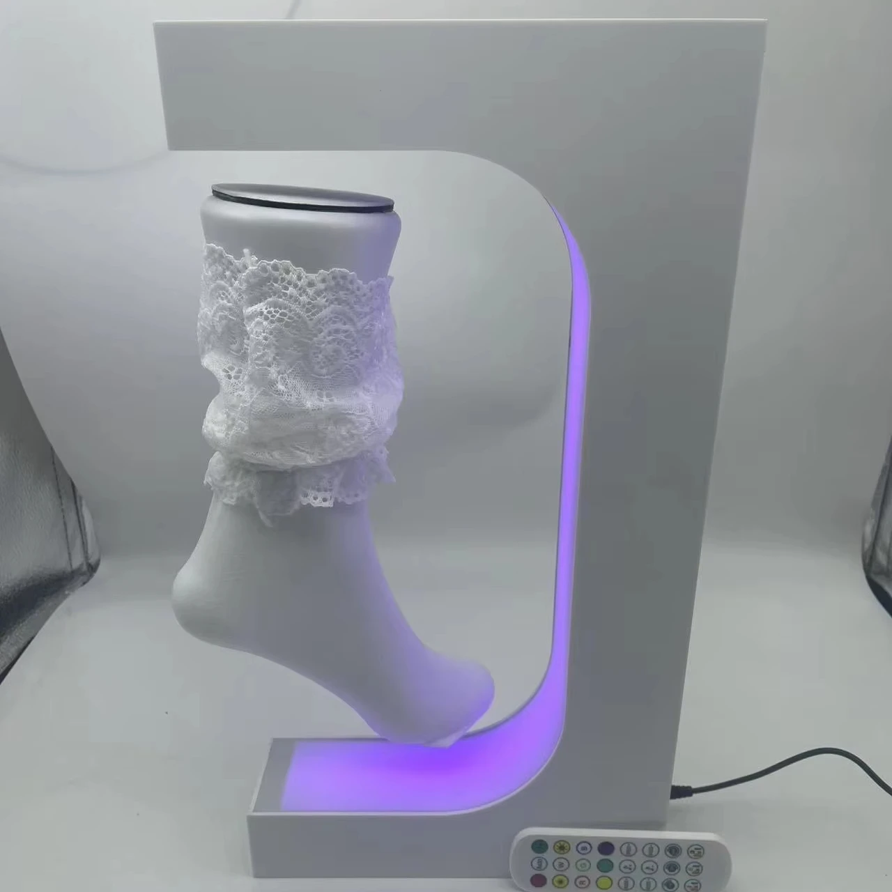 

Factory Wholesale Custom Magnetic Levitation Suspension Sock Display Stand With Cut Logo