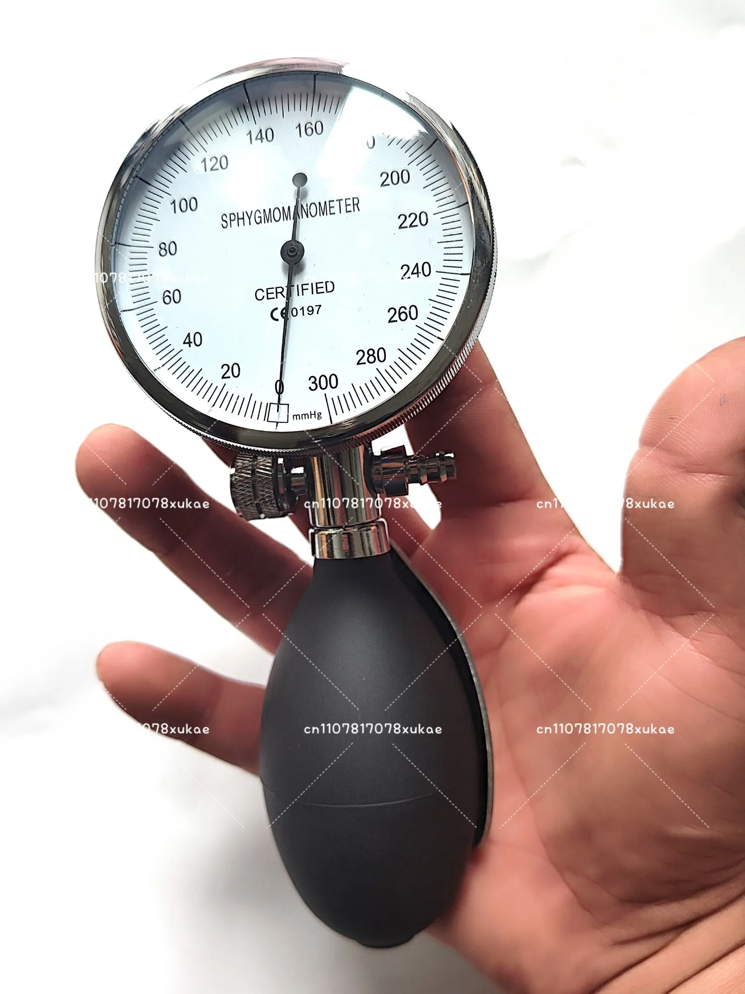 Holding A Gas Pressure Gauge, An Inflatable Pressure Gauge, A Leak Gauge, and A Hand-pinched Inflatable Endoscope Leak Gauge