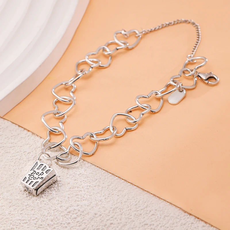 

Genuine 925 sterling silver Connected Hearts Charm Bracelet set with Popcorn Box Charm