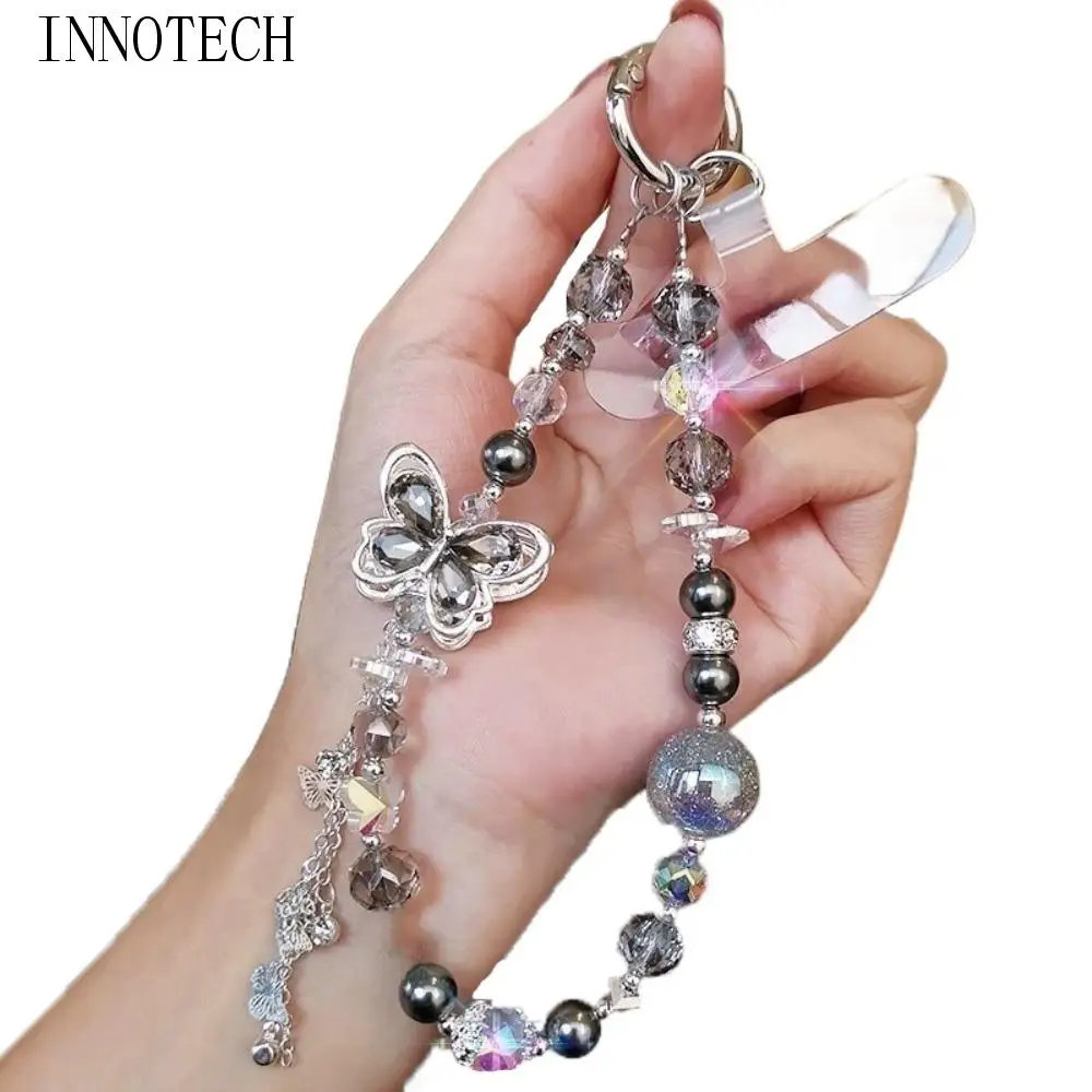 

Ремешок для телефона с бабочкой и кристаллами из бисера, цепочка на запястье с жемчугом, цепочка для мобильного телефона с защитой от потери, ручной ремешок для мобильного телефона для женщин/женщин/девочек