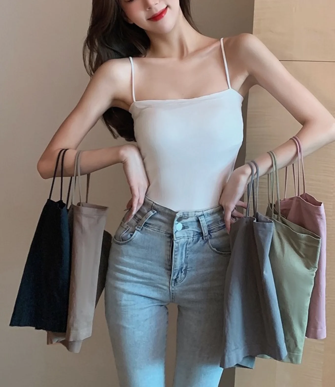 Fashionable seamless fixed bralette base top, which can be worn as an outer garment with a long strapless top without underwire.