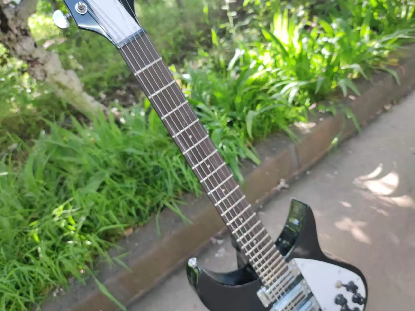 6strings black electric guitar, with a strange shape. High-quality, made of rosewood. Ships within 20 days.
