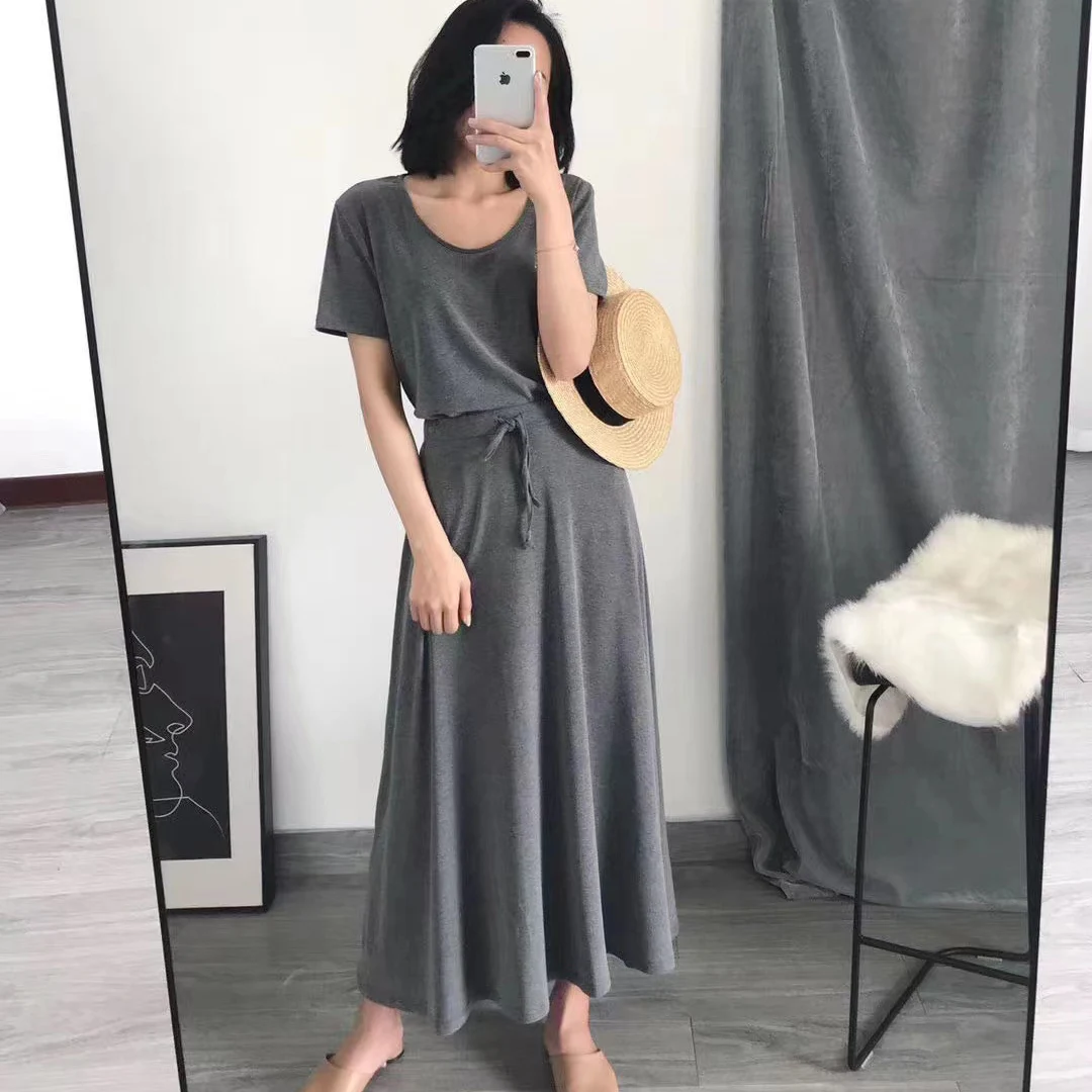 Conjunto casual de saia evasê com bainha ampla, duas peças, cseta modal foada com fenda lateral e saia midi, estilo core...