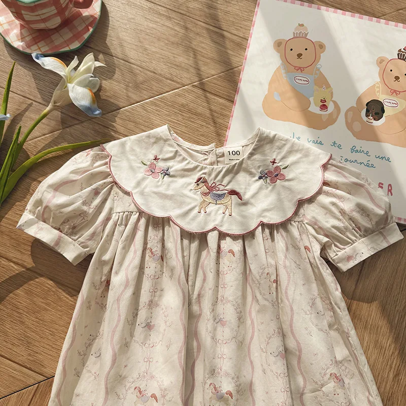 

Imported children's clothing with floral collar and little horse embroidery for girls2026Summer French-style printed puff-sleeve