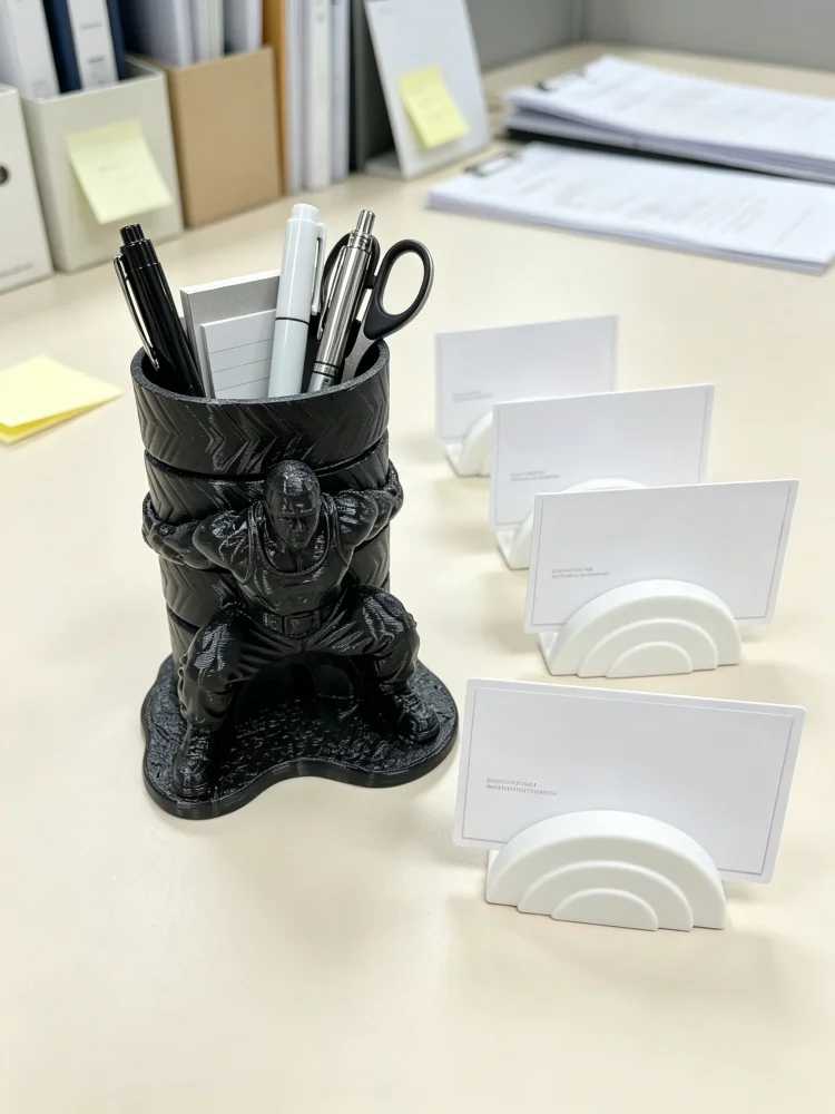 Quirky Human-Shaped Strongman Pen Holder + Minimalist Business Card Holder Combo, Muscle Man Statue Desktop Storage Box with Tire Design, Made of Solid Black Petg Plastic, Large Capacity Pen Holder for Storing Various Stationery, Curved Business Card Holder for Displaying Cards, Stable Base Saves Desktop Space, Cool and Unique Desktop Decoration, Suitable for Home Office, Classroom Workstations, as a Men's Gift, or as a Fun and Creative Gift for Fitness Enthusiasts