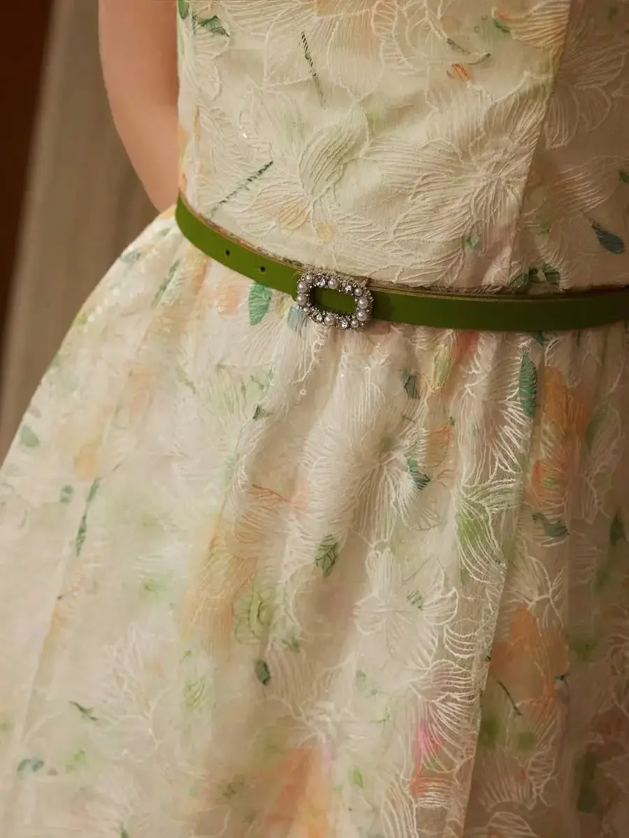 

Cream Sleeveless Midi Dress With Pastel Floral Embroidery And Green Belt Featuring Pearl-Encrusted Ornate Buckle