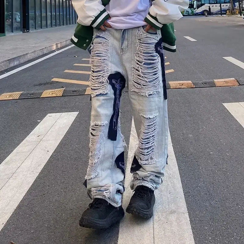 High Street Hip Hop Cuciture strappate Jeans decostruiti Design Sense Pantaloni a gamba dritta con toppa vintage Uomo Donna